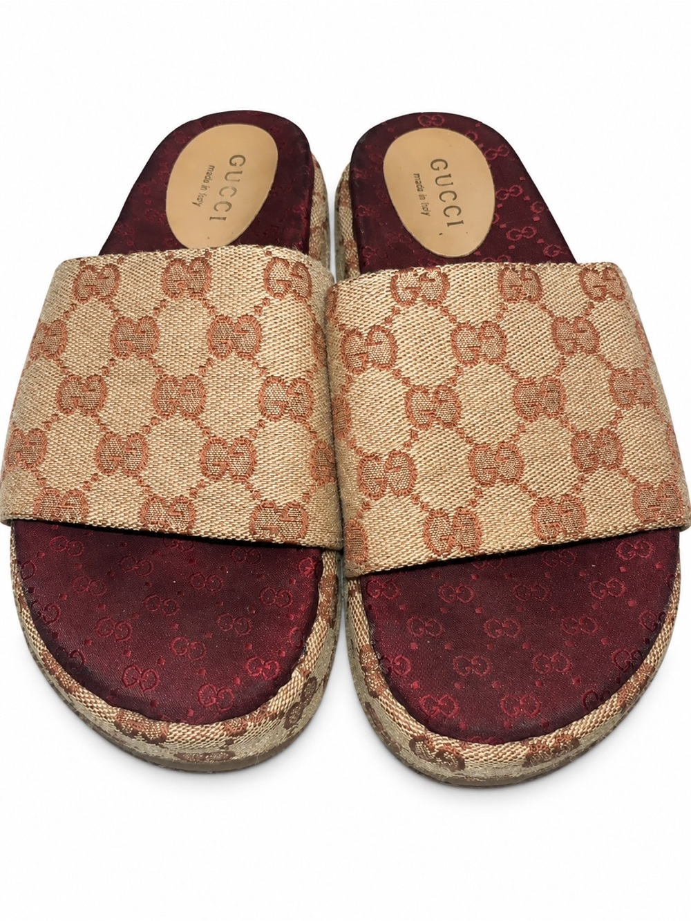 Gucci monogram platform slides in beige and burgundy.